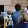 A crowd joins the Six Years Too Long rally to call for refugees in detention to be brought to Australia.