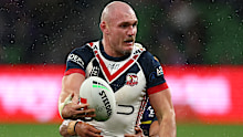 Roosters gun Angus Crichton shapes to offload.