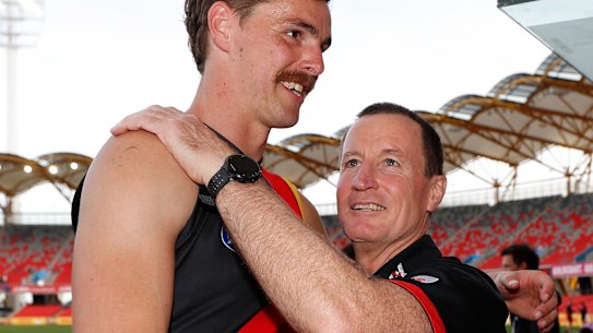 Bomber Joe Daniher and coach John Worsfold after the Bombers' last match of 2020.