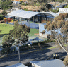 One child has been killed and four others seriously injured after car crashes into school in Melbourne’s east.
