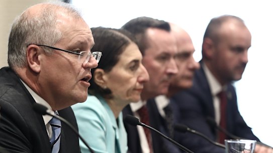 Prime Minister Scott Morrison addresses the media with premiers, chief ministers and Chief Medical Officer Brendan Murphy following a Council of Australian Governments meeting in Sydney.