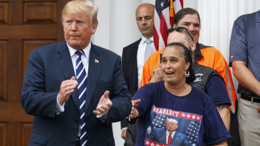 President Donald Trump is cheered by members of Bikers for Trump and supporters on  Saturday at the clubhouse of Trump National Golf Club in Bedminster, New Jersey. 