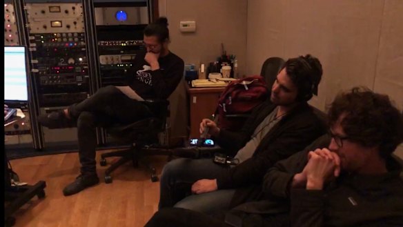 Tyler Gillett (far, right, in glasses) and PJ Vogt (wearing headphones) recreating the song in United Recording Studios, Los Angeles. 