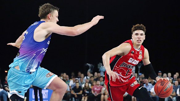 LaMelo Ball drives against Finn Delany of the Breakers at Spark Arena in Auckland.