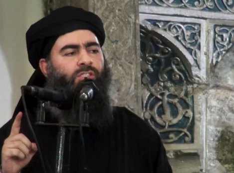 An image made from video posted on a militant website in 2014 purports to show Abu Bakr al-Baghdadi delivering a sermon at a mosque in Iraq.