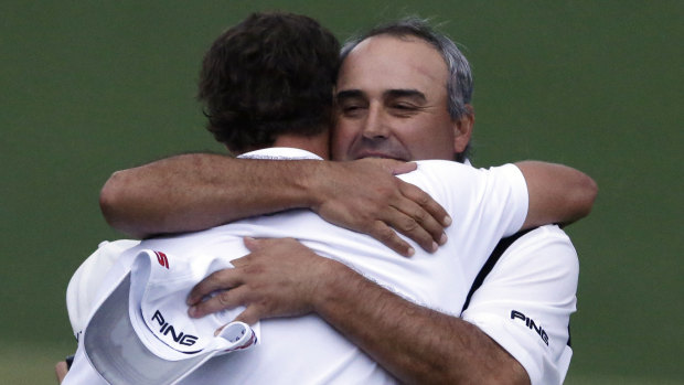 Adam Scott (left) and Angel Cabrera embrace after the 2013 Masters.