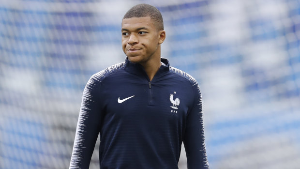 Rapid rise: France's Kylian Mbappe looks on at training.
