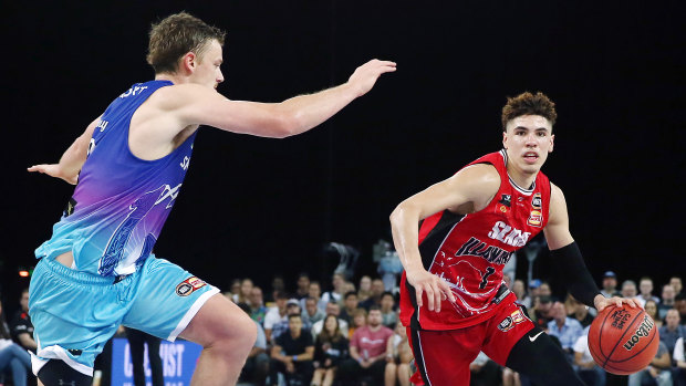 LaMelo Ball drives against Finn Delany of the Breakers at Spark Arena in Auckland.