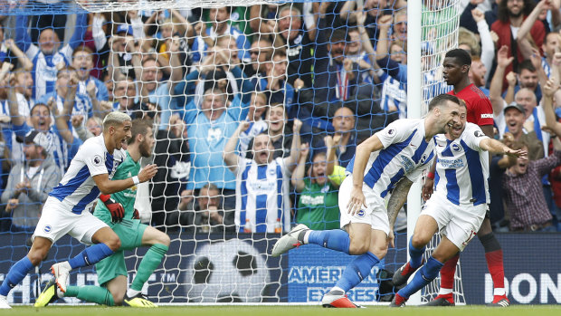 Victors: Brighton's Shane Duffy (second right) celebrates after scoring his side's second goal during the triumph over Manchester United.