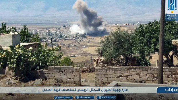 Smoke rising over buildings that were hit by airstrikes, in al-Sahan village, Idlib, Syria, on Tuesday.