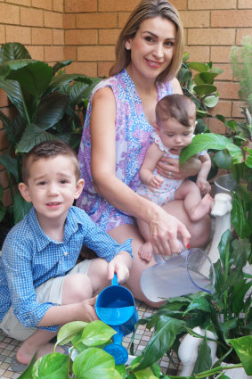  Tanya Lazarou is teaching her children - Logan, 4, and Lara, eight months - the value of water conservation. 