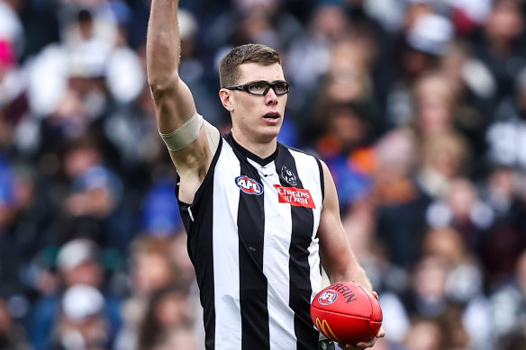 Hands up who wants a new contract: Mason Cox has re-signed for two more years at the Magpies. 