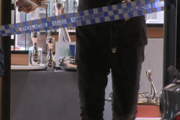 Police guard the crime scene on Friday.