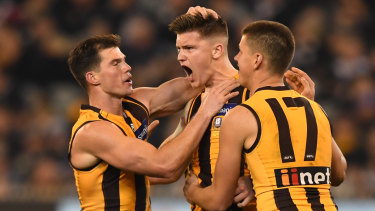 Mitchell Lewis celebrates a vital last-quarter goal against Collingwood on Friday night.