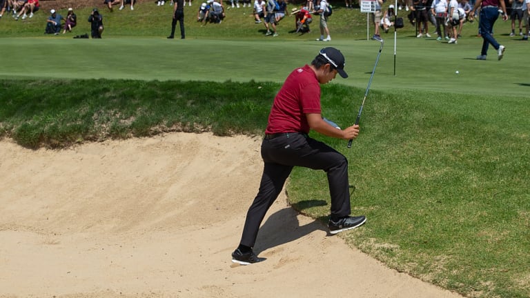 Day to forget: Byeong Hun An trudges out of the bunker on the eighth.