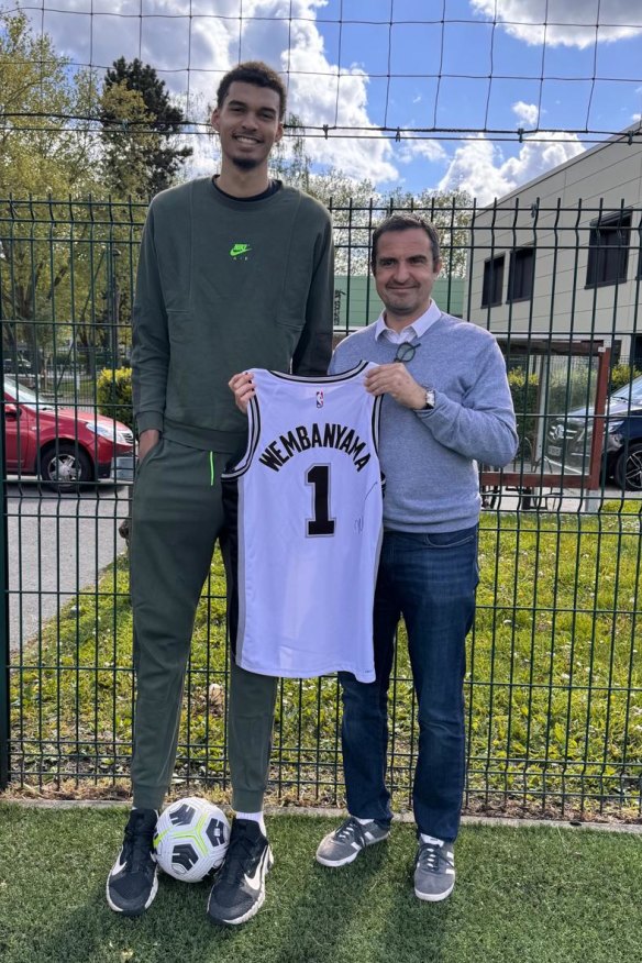 Wembanyama, now 224 centimetres, dwarfs Mayor Richard Delepierre on a recent visit home to Le Chesnay, 17 kilometres west of Paris.