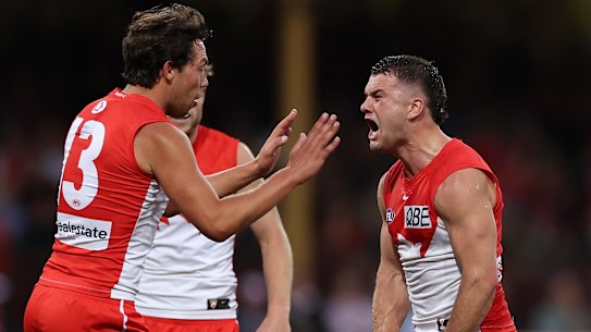 Tom Papley of the Swans celebrates kicking a goal with Oliver Florent of the Swans.