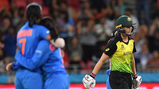 India celebrate the wicket of Meg Lanning in the Women's T20 World Cup opener. 