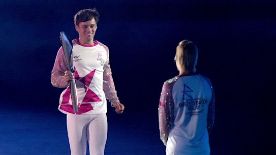 Tom Daley hands off the Commonwealth Baton to Alex Danson-Bennett during Thursday’s opening ceremony.