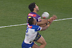 Siulagi Tuimalatu-Brown and Jethro Rinakama fight for the ball in the kick contest.