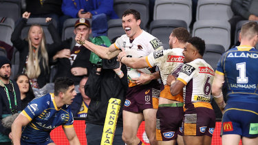Corey Oates celebrates a try against the Eels.