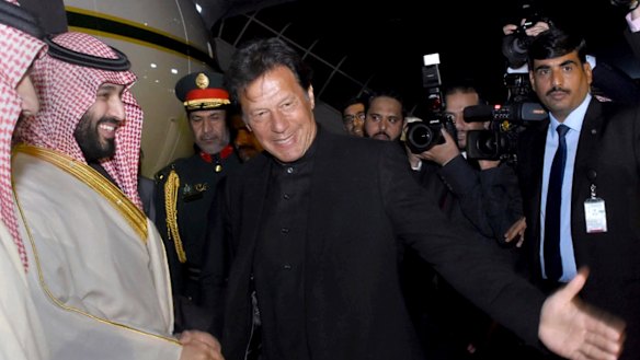 Pakistani Prime Minister Imran Khan, centre, greets Saudi Arabia's Crown Prince Mohammed bin Salman, left, upon his arrival at Nur Khan airbase in Rawalpindi, Pakistan, on Sunday.