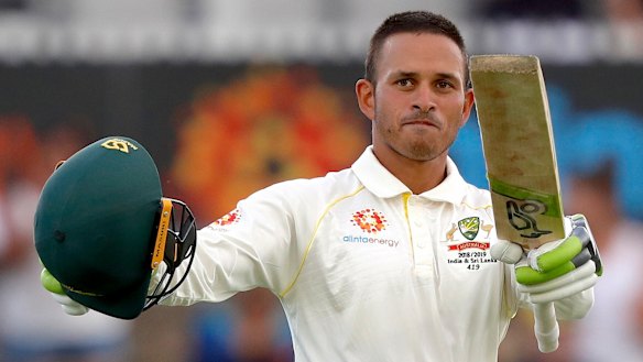 Breakthrough: Usman Khawaja celebrates after reaching his century.