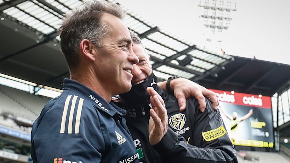 Alastair Clarkson and Damien Hardwick embrace after a dramatic draw.