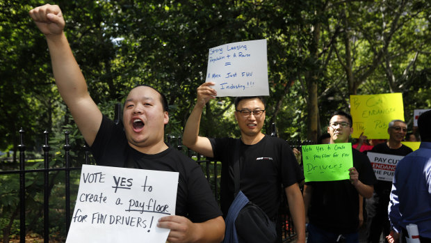 Drivers of for-hire vehicles in New York demonstrate in support of a cap on ride-hail vehicles outside City Hall earlier this month.