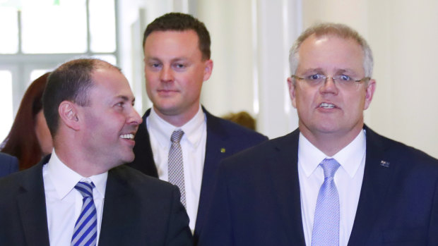 Treasurer of Australia Scott Morrison, right, walks with deputy Josh Frydenberg