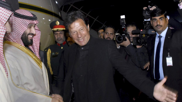 Pakistani Prime Minister Imran Khan, centre, greets Saudi Arabia's Crown Prince Mohammed bin Salman, left, upon his arrival at Nur Khan airbase in Rawalpindi, Pakistan, on Sunday.