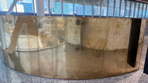 Brass panels on the WA Museum’s ‘golden staircases’ are strewn with hand marks and graffiti.
