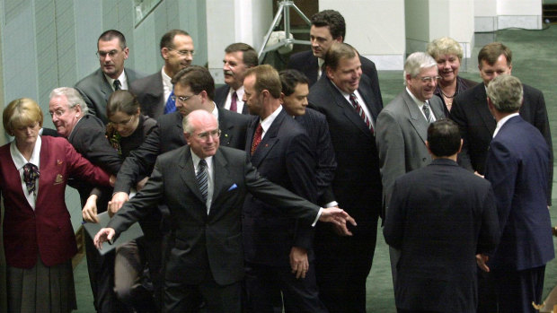 Prime minister John Howard and parliamentary staff prevent Greens senators Kerry Nettle (third from left) and Bob Brown (behind her) from approaching president George W. Bush (far right) on October 23, 2003.