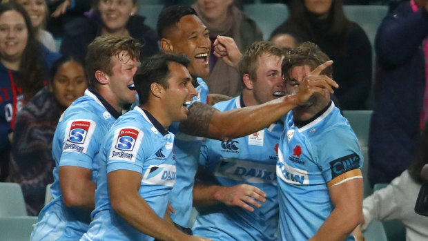 Drought-breaker: The Tahs celebrate on their way to the first Australian side's win over a New Zealand team in 722 days.