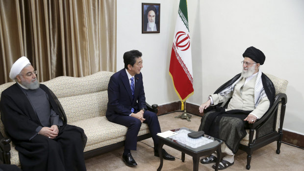 Japanese Prime Minister Shinzo Abe, centre, meets with Iran's Supreme Leader Ayatollah Ali Khamenei in Tehran on Thursday. Iranian President Hassan Rouhani is at left.