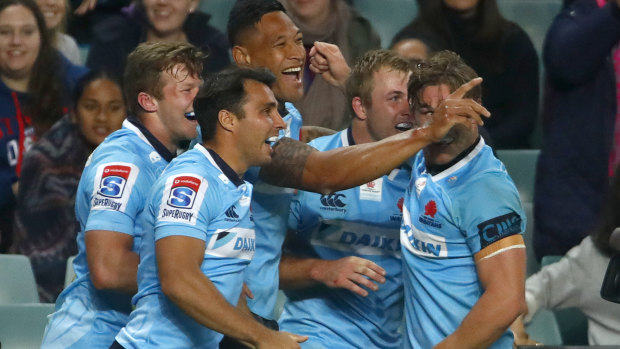 Drought-breaker: The Tahs celebrate on their way to the first Australian win over a New Zealand team in 722 days.