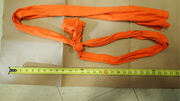 A piece of fabric used as a noose is displayed, as part of the investigation into Epstein’s death.
