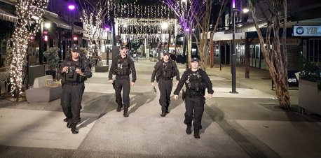 Senior Constable Aaron Izzard (second from left) patrols Fortitude Valley as part of the Public Safety Response Team.