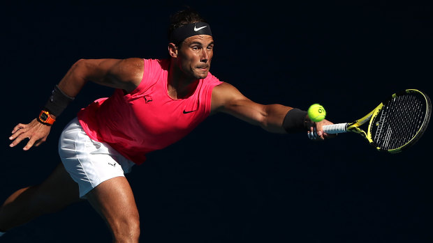 Relentless: Rafa Nadal chases down another ball during his third-round win over compatriot Pablo Carreno Busta.