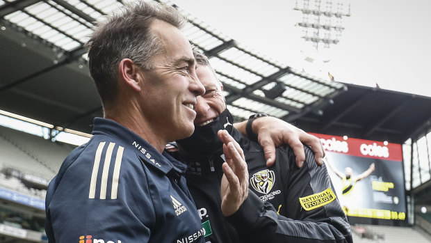 Alastair Clarkson and Damien Hardwick embrace after a dramatic draw.