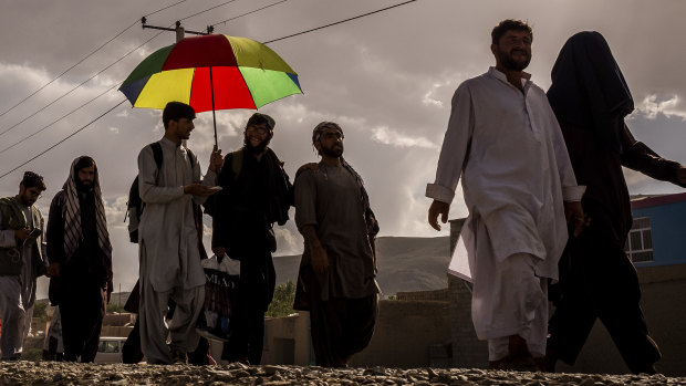 Zaheer Zindani, far right, and his friend Kitab marching outside Ghazni last month.