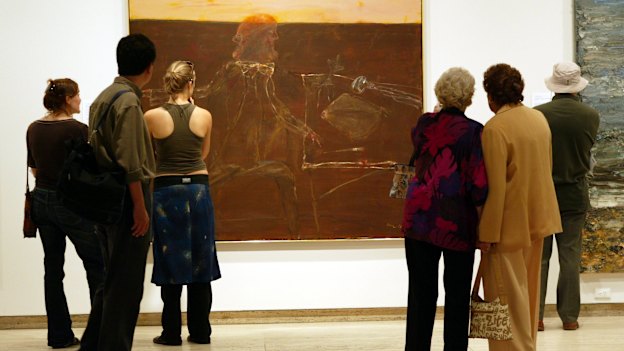 People look at John Olsen’s 2005 Archibald Prize-winning painting,  Self-portrait Janus-faced.