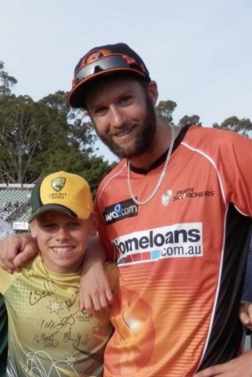 A young Cooper Connolly with Perth Scorchers quick A.J. Tye.