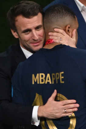 France President Emmanuel Macron consoles Kylian Mbappe.