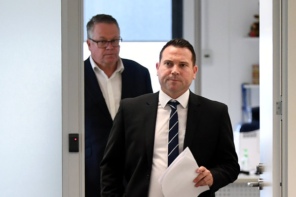 A-League boss Greg O'Rourke flanks FFA chief executive James Johnson as he prepares to enter Tuesday's press conference.