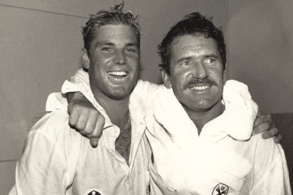 Shane Warne and Allan Border celebrate.