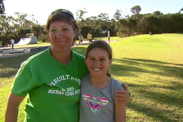 Josephine, 11, and her mother Julie speak to a reporter about being rescued from the surf at Moggs Creek by AFL footballer Patrick Dangerfield on Sunday.