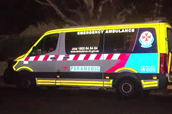 An ambulance at a house in Northcote where a 49-year-old woman is believed to have died with COVID-19 on Tuesday.