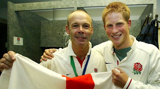 Prince Harry poses with England coach Clive Woodward after England defeated Australia in the final of the Rugby World Cup.