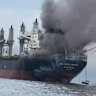A Thai cargo vessel on fire in the Strait of Hormuz, reflecting the danger of Iranian attacks.